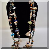 J120. Double strand beaded necklace with animal carvings, shells and turquoise. - $60